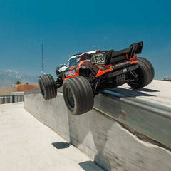 1/10 VORTEKS MEGA 550 Brushed 2WD Stadium Truck RTR with Battery & Charger, Oran