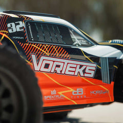 1/10 VORTEKS MEGA 550 Brushed 2WD Stadium Truck RTR with Battery & Charger, Oran